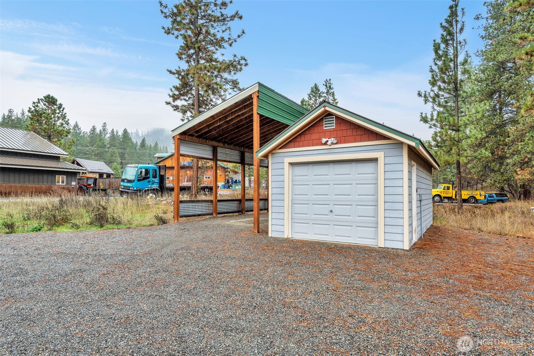 11650 Eagle Creek Road Leavenworth, WA 98826 - Photo 30 of 38 a front view of a house with a yard and garage