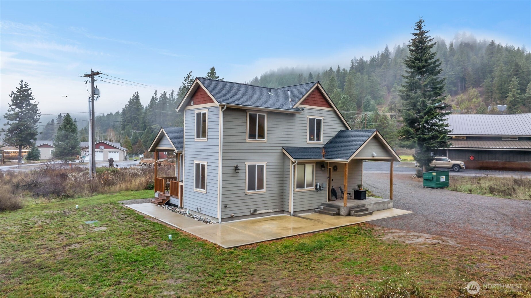 11650 Eagle Creek Road Leavenworth, WA 98826 - Photo 33 of 38 a view of a house with a yard patio and fire pit