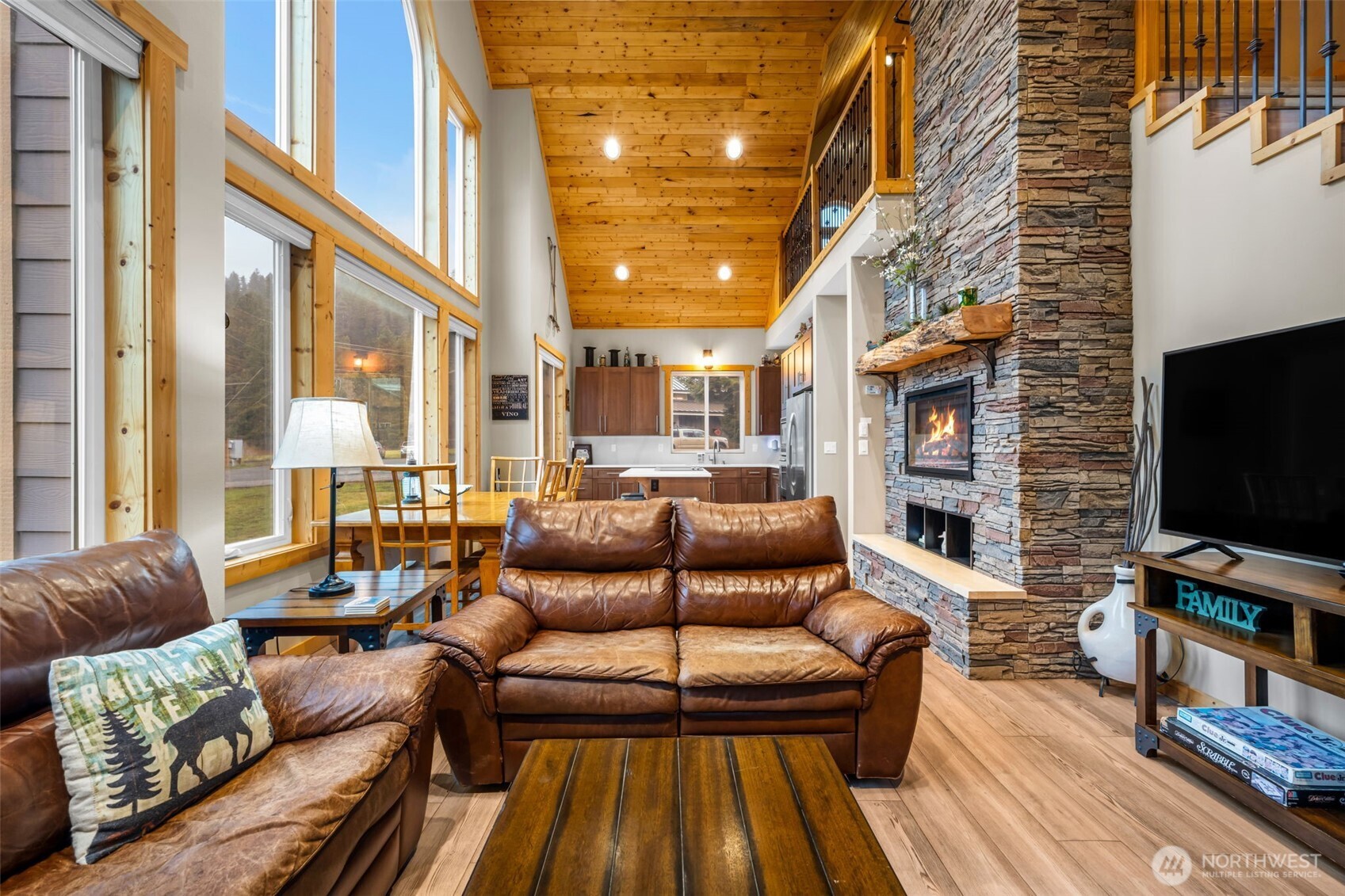 11650 Eagle Creek Road Leavenworth, WA 98826 - Photo 4 of 38 a living room with furniture and a flat screen tv