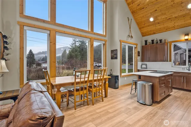 a large kitchen with a table and chairs