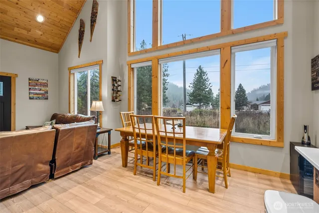 a view of a dining room with furniture window and wooden floor