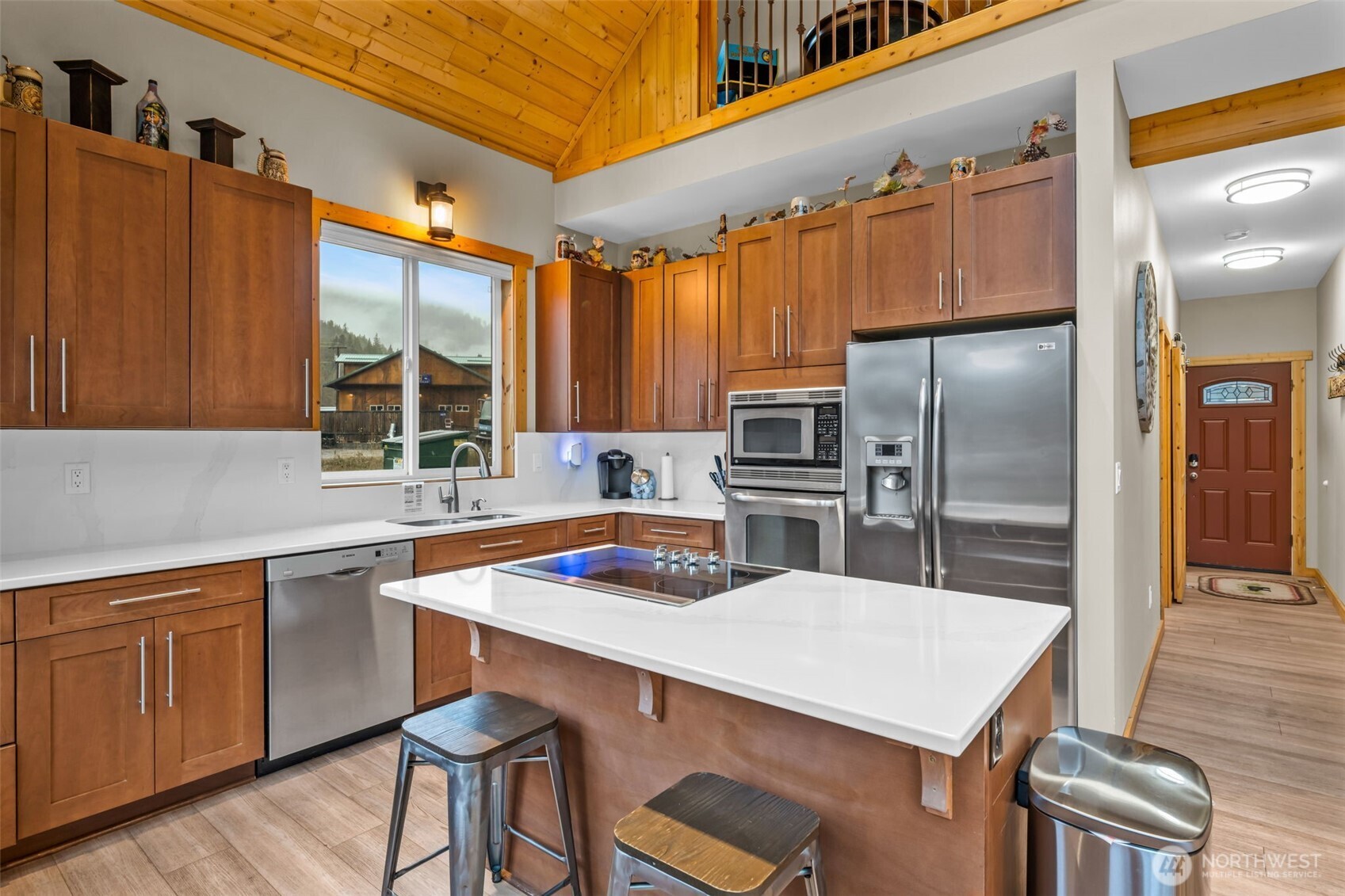 11650 Eagle Creek Road Leavenworth, WA 98826 - Photo 10 of 38 a kitchen with cabinets a counter space stainless steel appliances and cabinets