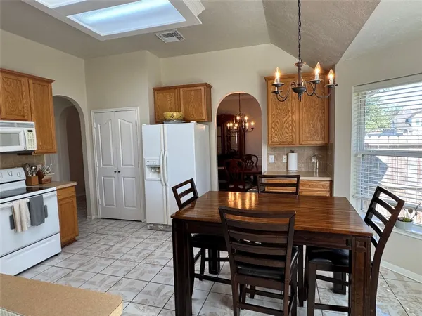 a view of a dining room with furniture and window