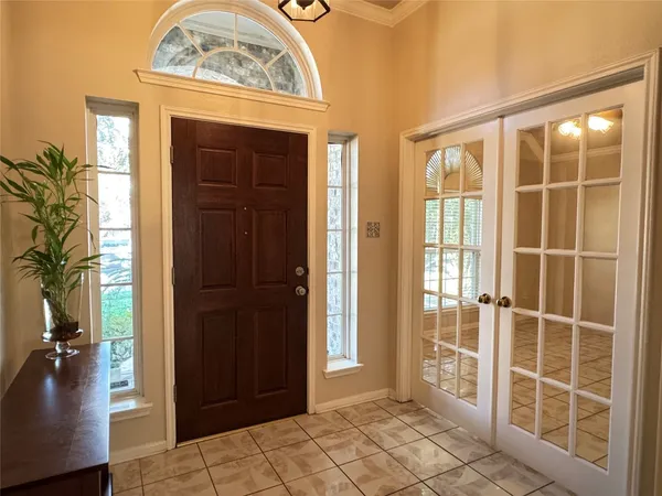 a view of an entryway with a door