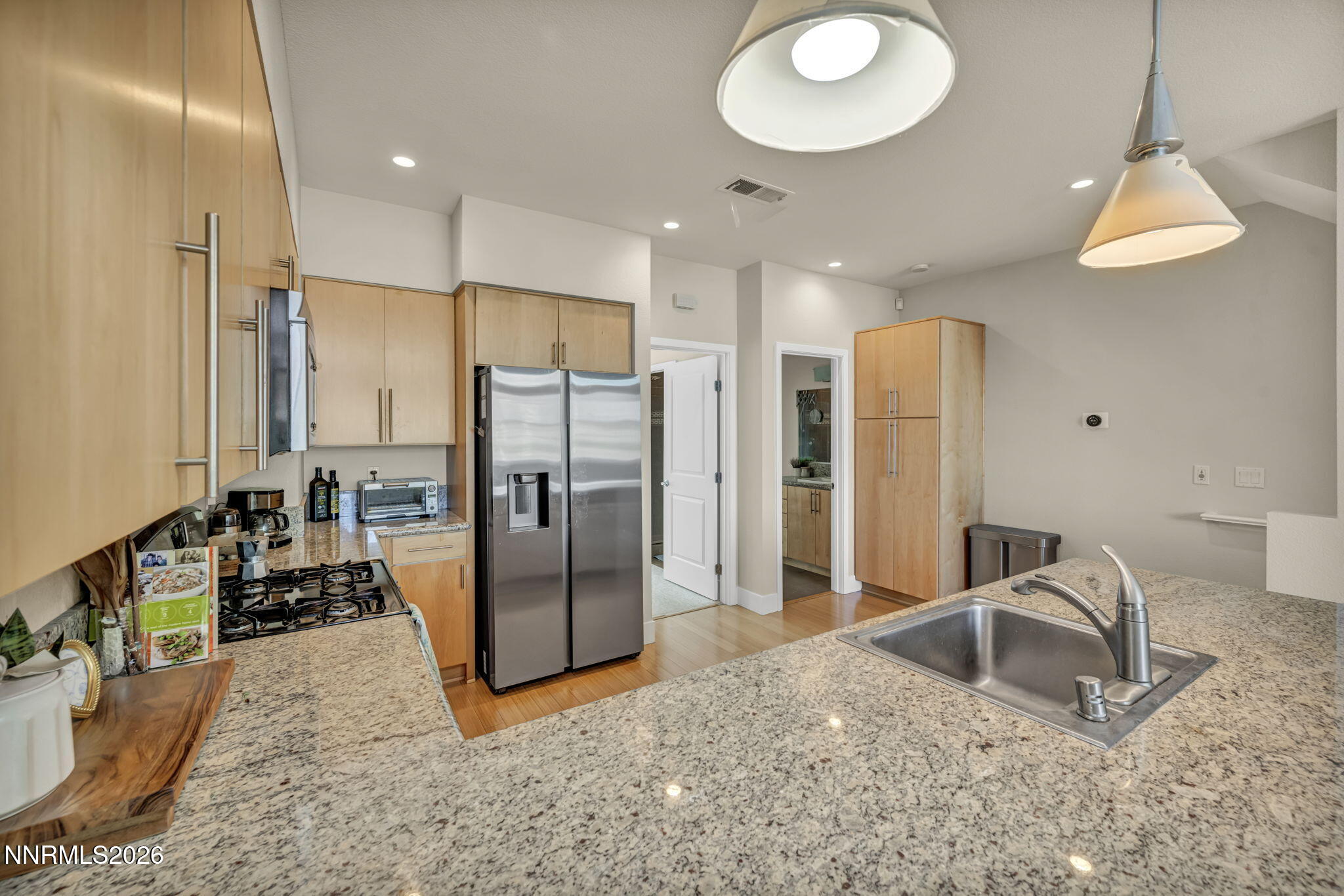 326 State Street Reno, NV 89501 - Photo 24 of 49 a kitchen with refrigerator and chairs