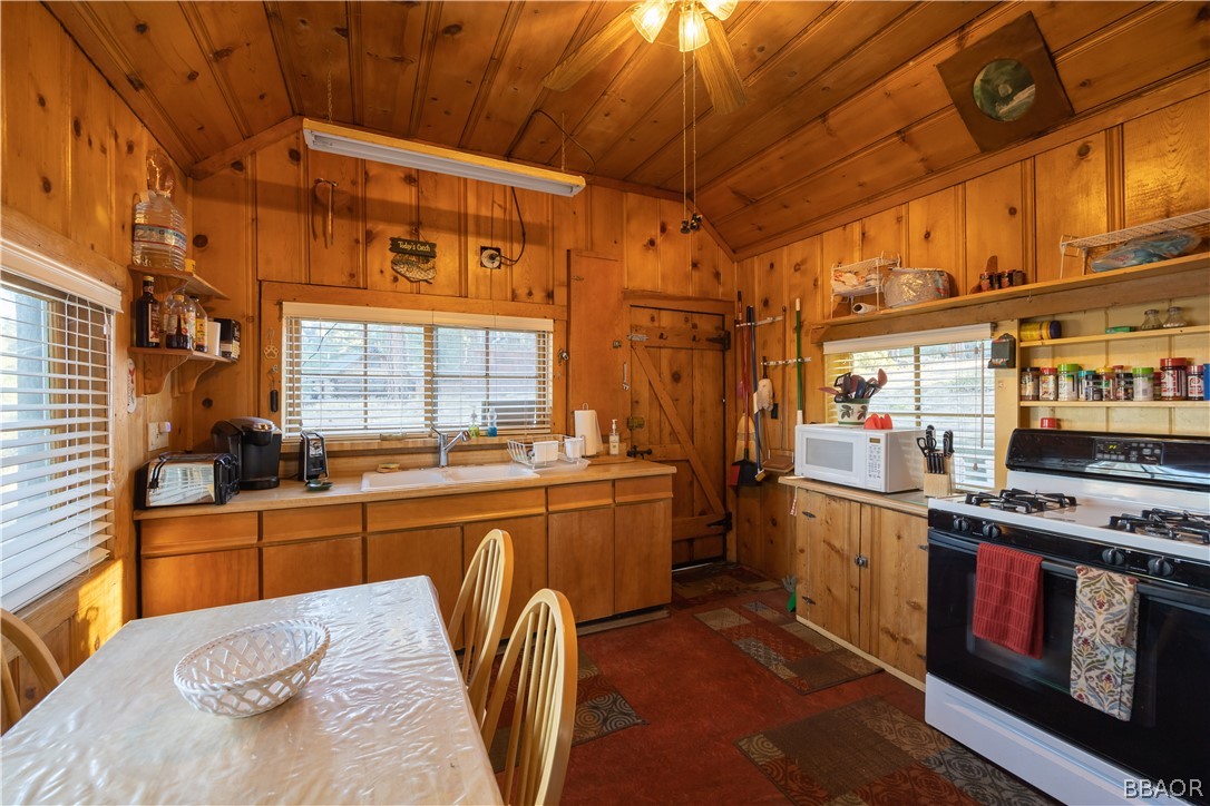 32 Big Bear Boulevard Big Bear Lake, CA 92315 - Photo 22 of 41 a kitchen with stainless steel appliances granite countertop a stove a sink and dishwasher