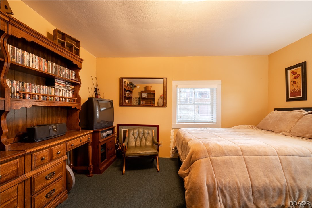 32 Big Bear Boulevard Big Bear Lake, CA 92315 - Photo 33 of 41 a bedroom with a bed furniture and paintings on the wall