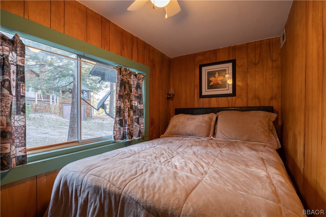 32 Big Bear Boulevard Big Bear Lake, CA 92315 - Photo 35 of 41 a large bed sitting in a bedroom next to a window