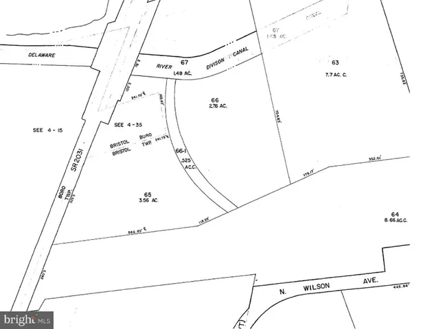 a view of a room with a white wall and white door