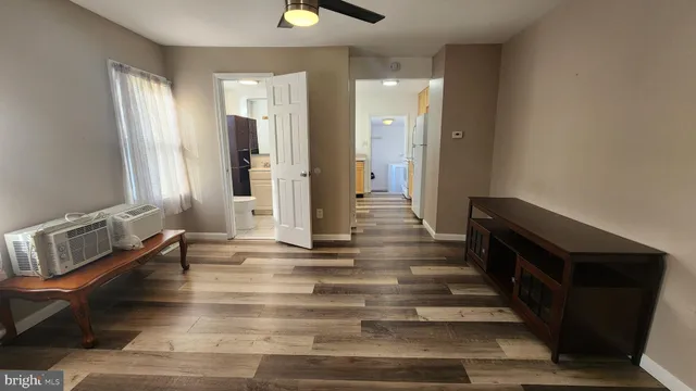 a view of an entryway door and hallway