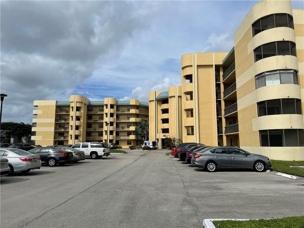 Undisclosed Address Lauderhill, FL 33313 - Photo 3 of 3 a car parked in front of a building
