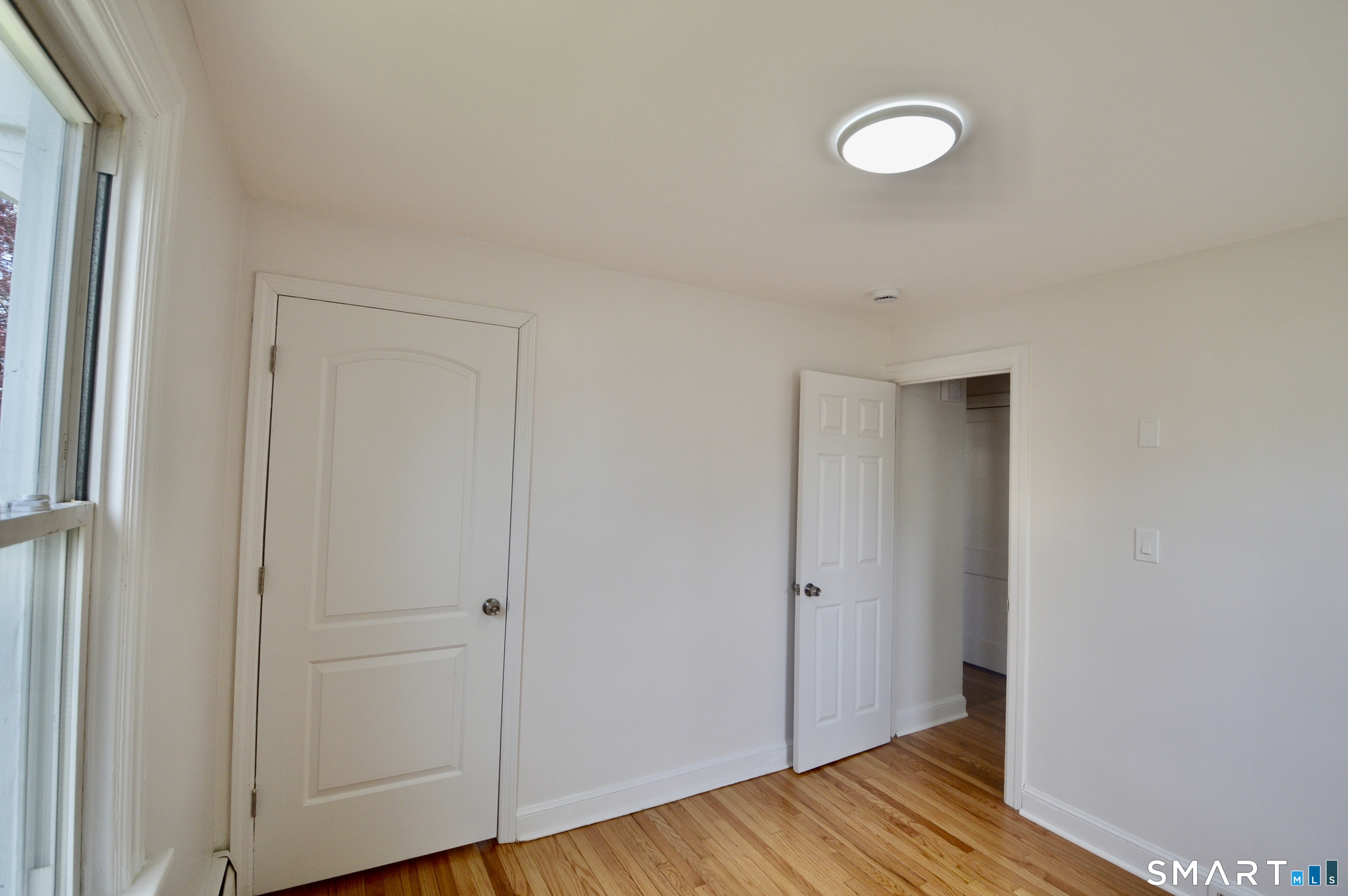 314 Knowlton Street Stratford, CT 06615 - Photo 11 of 26 a view of a room with wooden floor