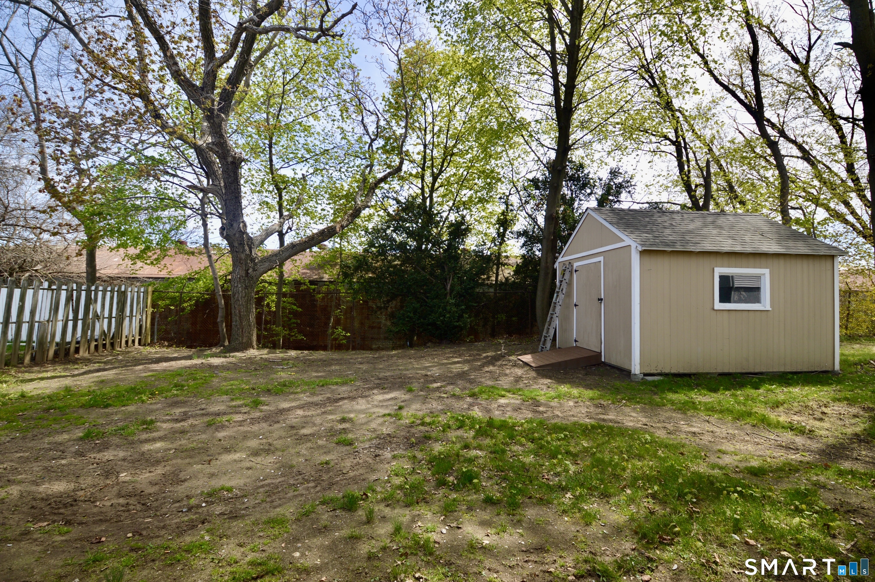 314 Knowlton Street Stratford, CT 06615 - Photo 26 of 26 a backyard of a house with lots of green space
