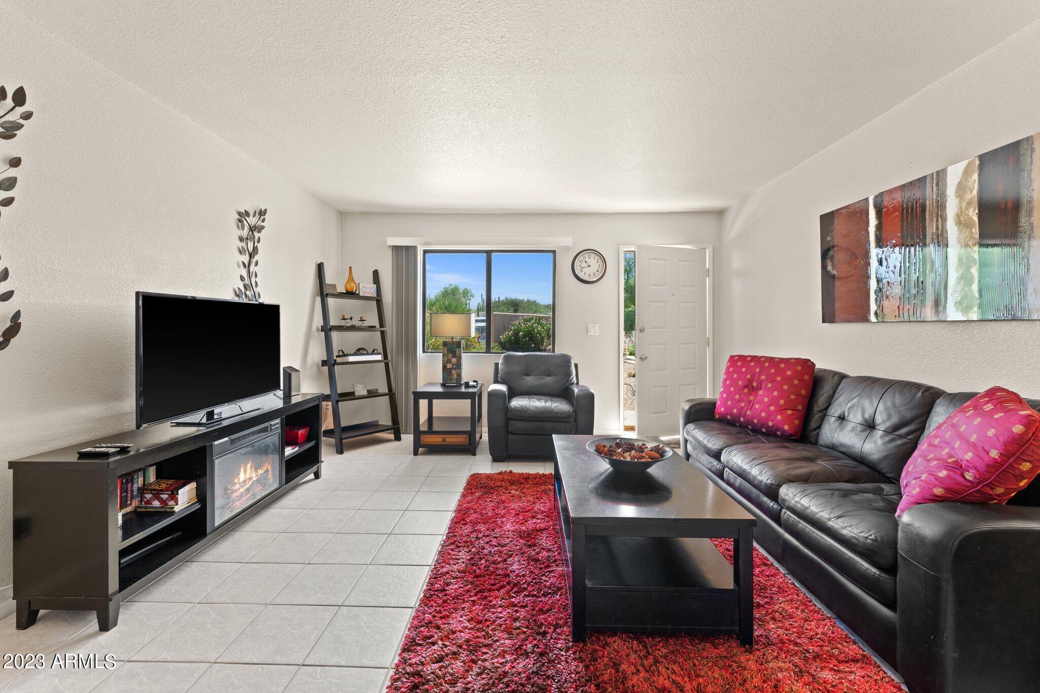 540 South West Road, Unit 26 Wickenburg, AZ 85390 - Photo 1 of 14 a living room with furniture and a flat screen tv