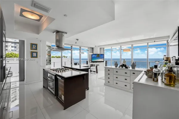 a kitchen with a stove a sink and a table