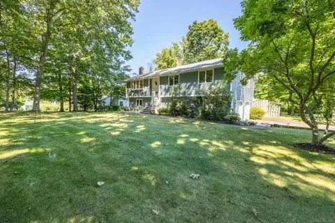 a view of a house with a big yard