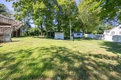 a swimming pool with trees in front of it