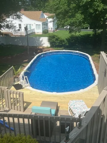 a view of a swimming pool with a lake view