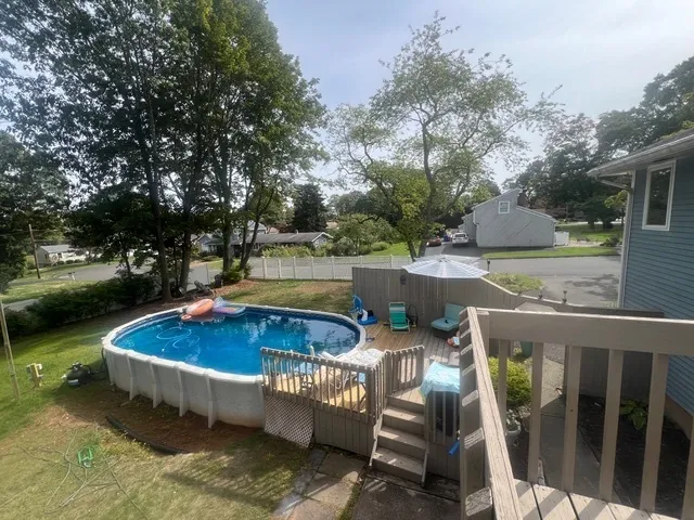 a view of a backyard with sitting area and outdoor kitchen