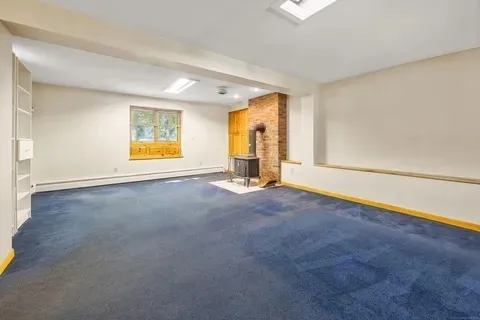 an empty room with a empty space and windows