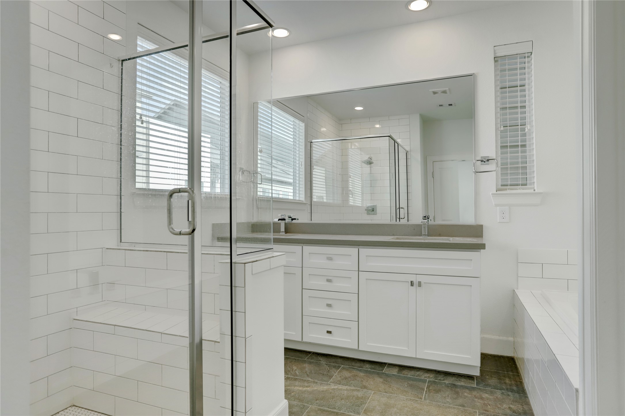 954 West 18th Street Houston, TX 77008 - Photo 16 of 30 Skip the spa and retreat to your private en-suite bathroom, which boasts dual sink vanities with quartz counters, designer fixtures, and an over-sized mirror.