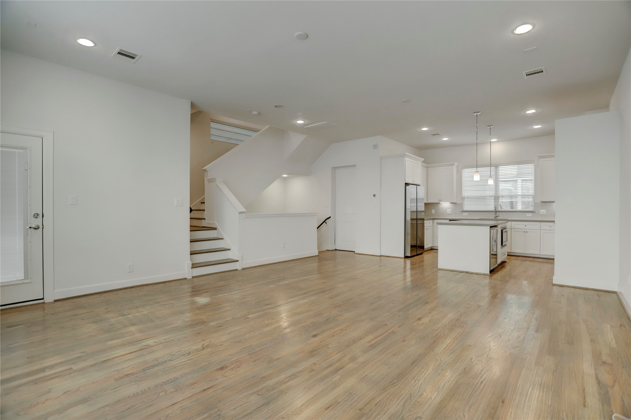 954 West 18th Street Houston, TX 77008 - Photo 30 of 30 The kitchen opens directly to the dining space and family room in this wonderful open-concept floor plan. Engineered hardwood floors and recessed lighting carry throughout.