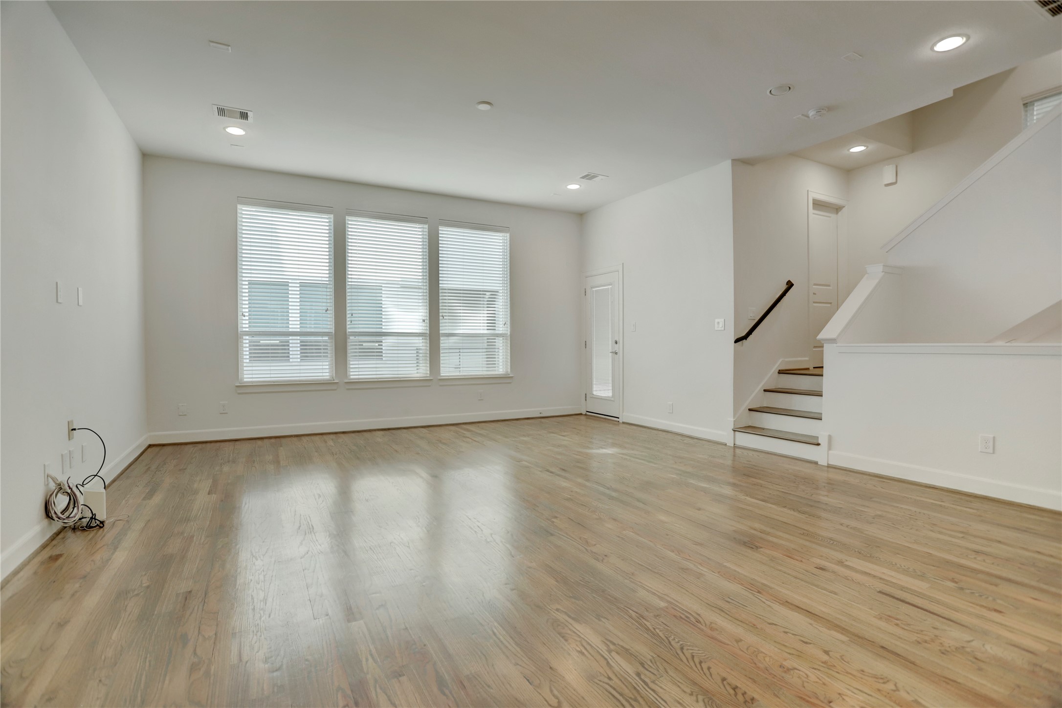 954 West 18th Street Houston, TX 77008 - Photo 9 of 30 A wall of windows with 2" blinds floods the main living spaces with fantastic natural light.