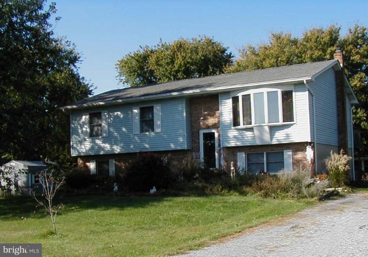 409 Skipper Lane Chester, MD 21619 - Photo 2 of 10 a front view of a house with a yard