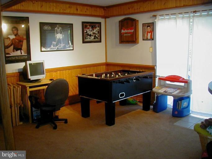 409 Skipper Lane Chester, MD 21619 - Photo 7 of 10 a room with furniture and air hockey table
