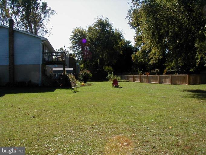 409 Skipper Lane Chester, MD 21619 - Photo 8 of 10 a view of a backyard with a garden