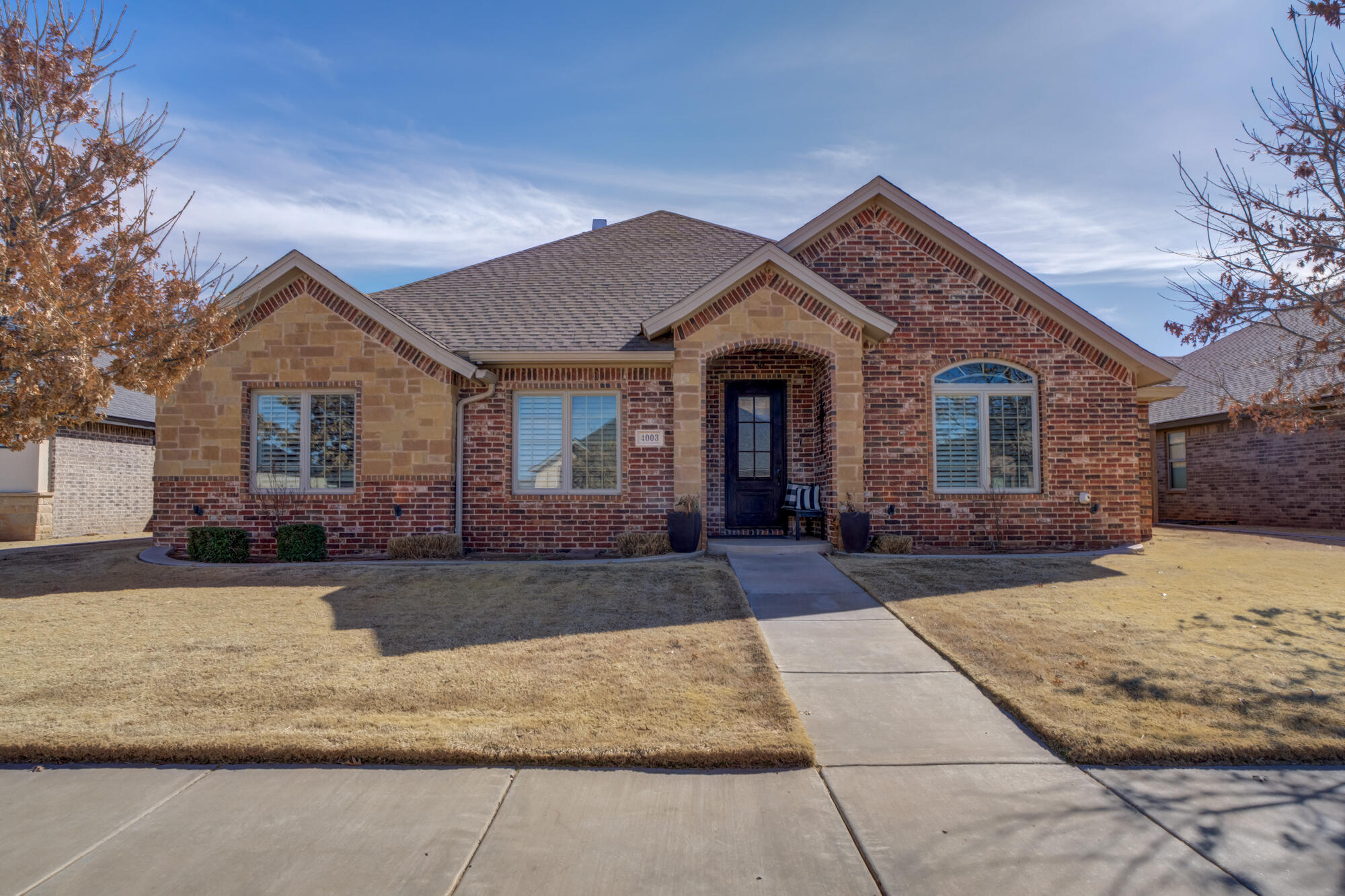 4003 128th Street Lubbock, TX 79423 - Photo 1 of 16 a front view of a house with a yard