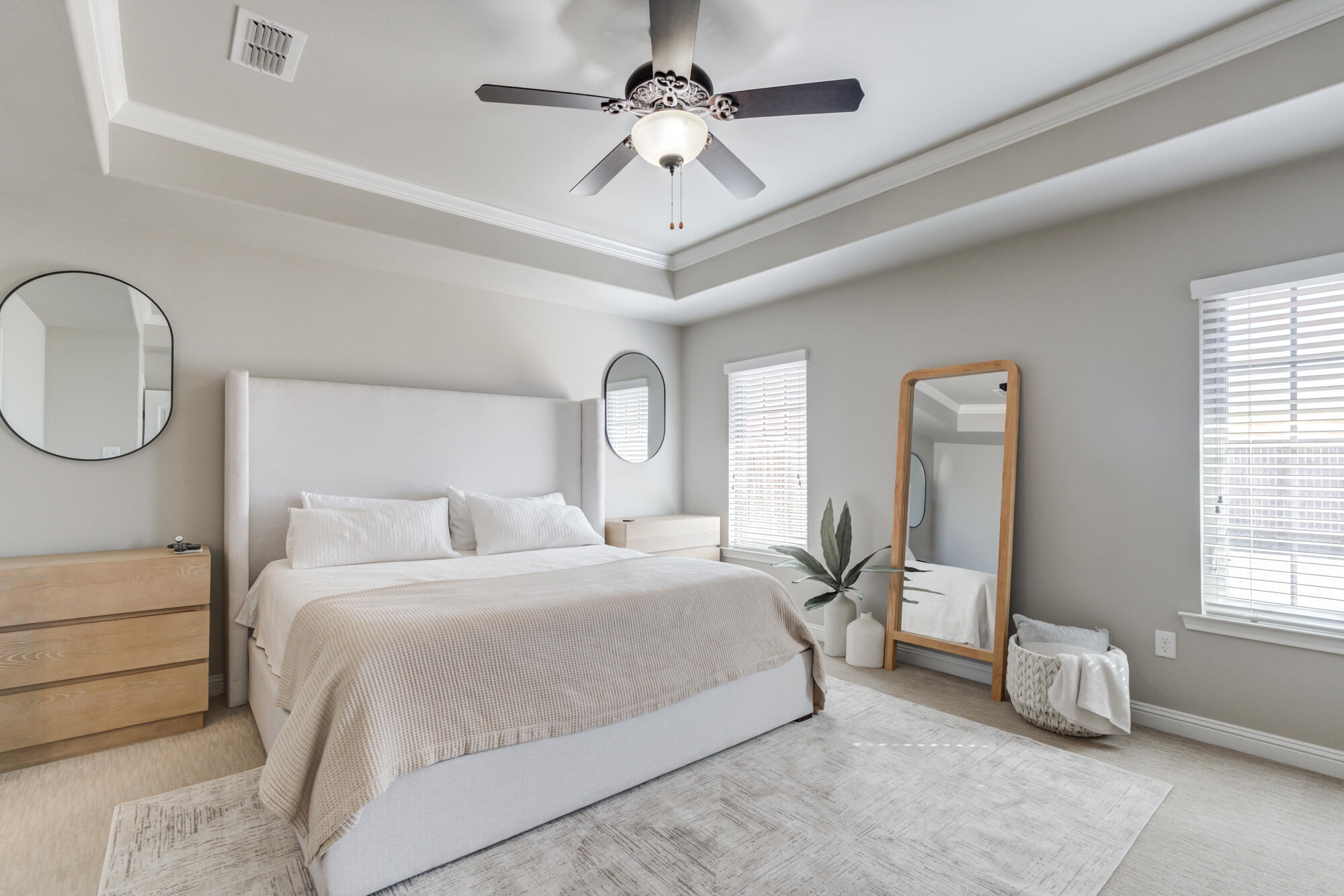 4003 128th Street Lubbock, TX 79423 - Photo 12 of 16 a bedroom with a large bed and a chandelier fan