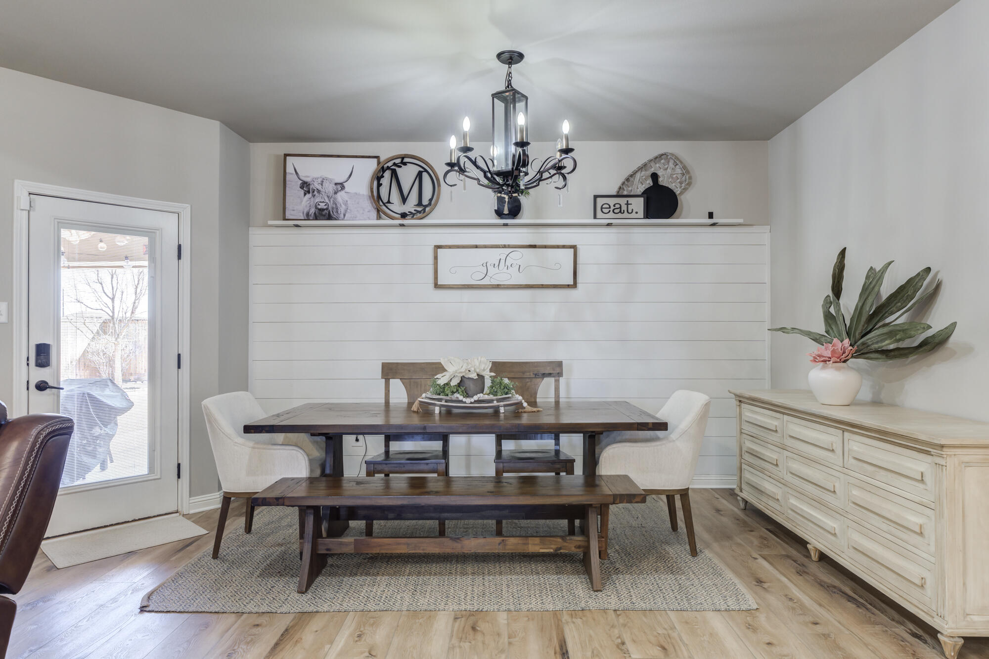 4003 128th Street Lubbock, TX 79423 - Photo 4 of 16 a view of a dining room with furniture and wooden floor