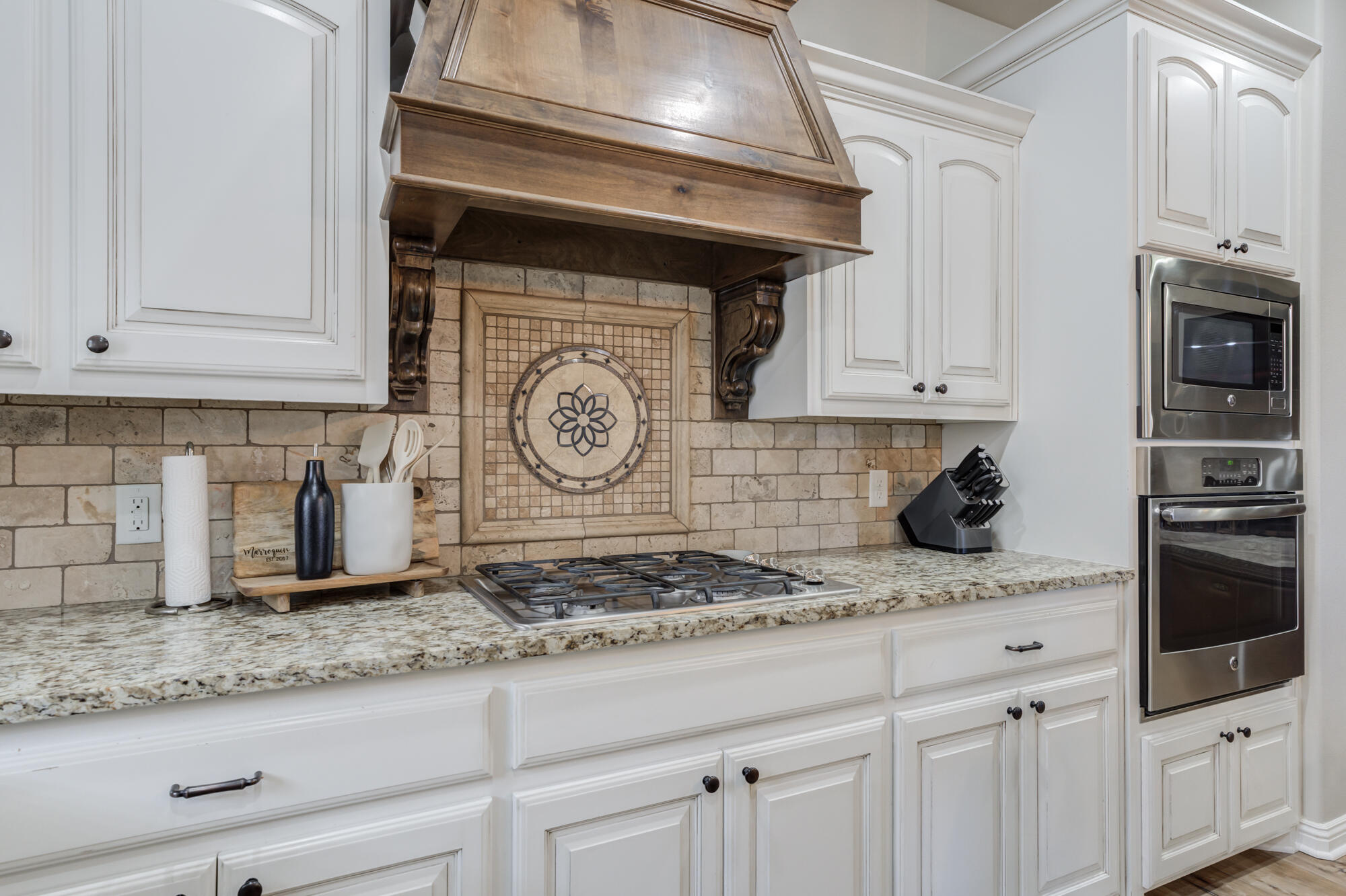 4003 128th Street Lubbock, TX 79423 - Photo 6 of 16 a kitchen with granite countertop a stove and cabinets