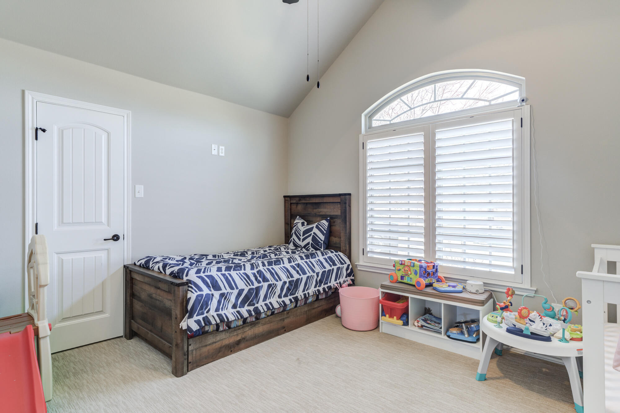 4003 128th Street Lubbock, TX 79423 - Photo 7 of 16 a bedroom with bed and a chandelier