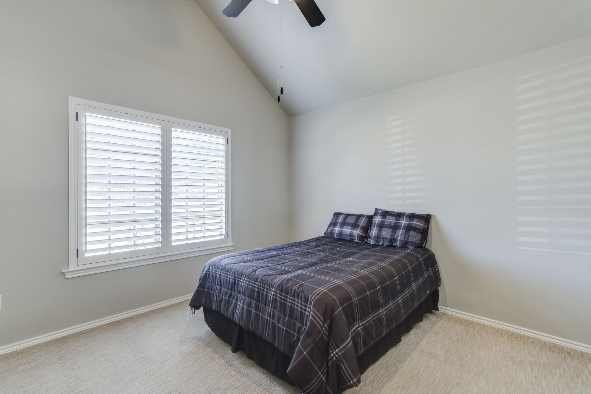 4003 128th Street Lubbock, TX 79423 - Photo 10 of 16 a bedroom with a bed and window