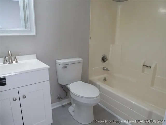 a bathroom with a toilet a sink and bathtub