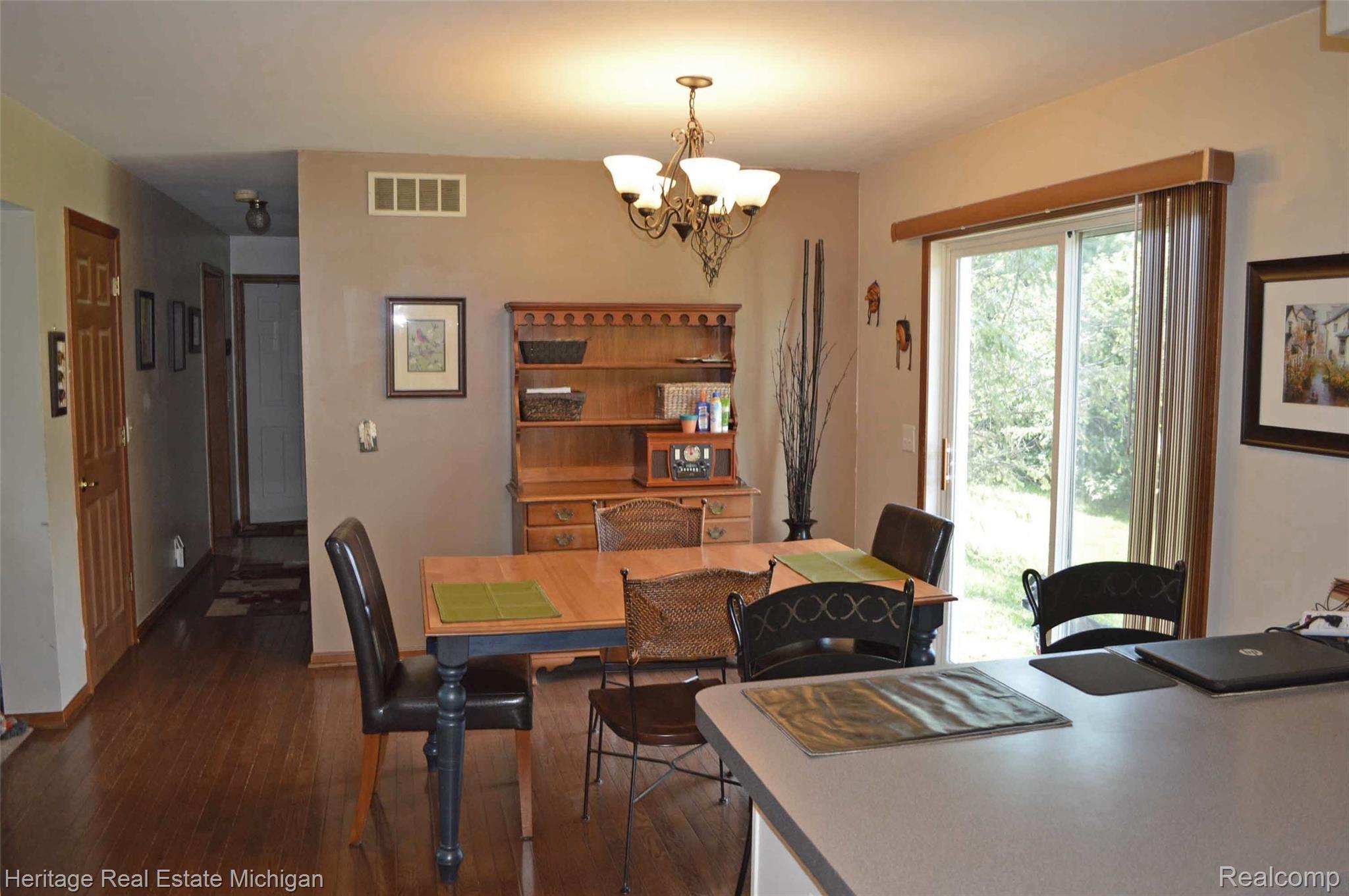 285 North Hughes Road Howell, MI 48843 - Photo 5 of 13 Comfortable place for meals or use the door wall to go outside