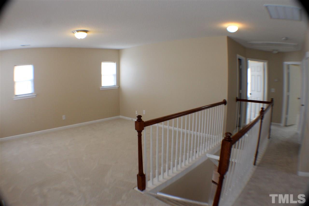 2856 Roundleaf Court Raleigh, NC 27604 - Photo 17 of 24 a view of a hallway with windows