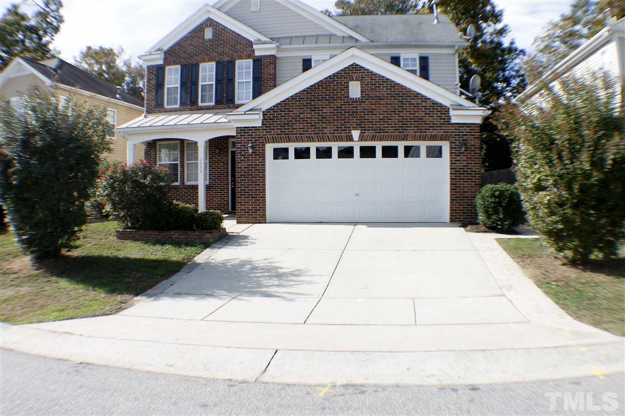 2856 Roundleaf Court Raleigh, NC 27604 - Photo 3 of 24 a front view of a house with a garden