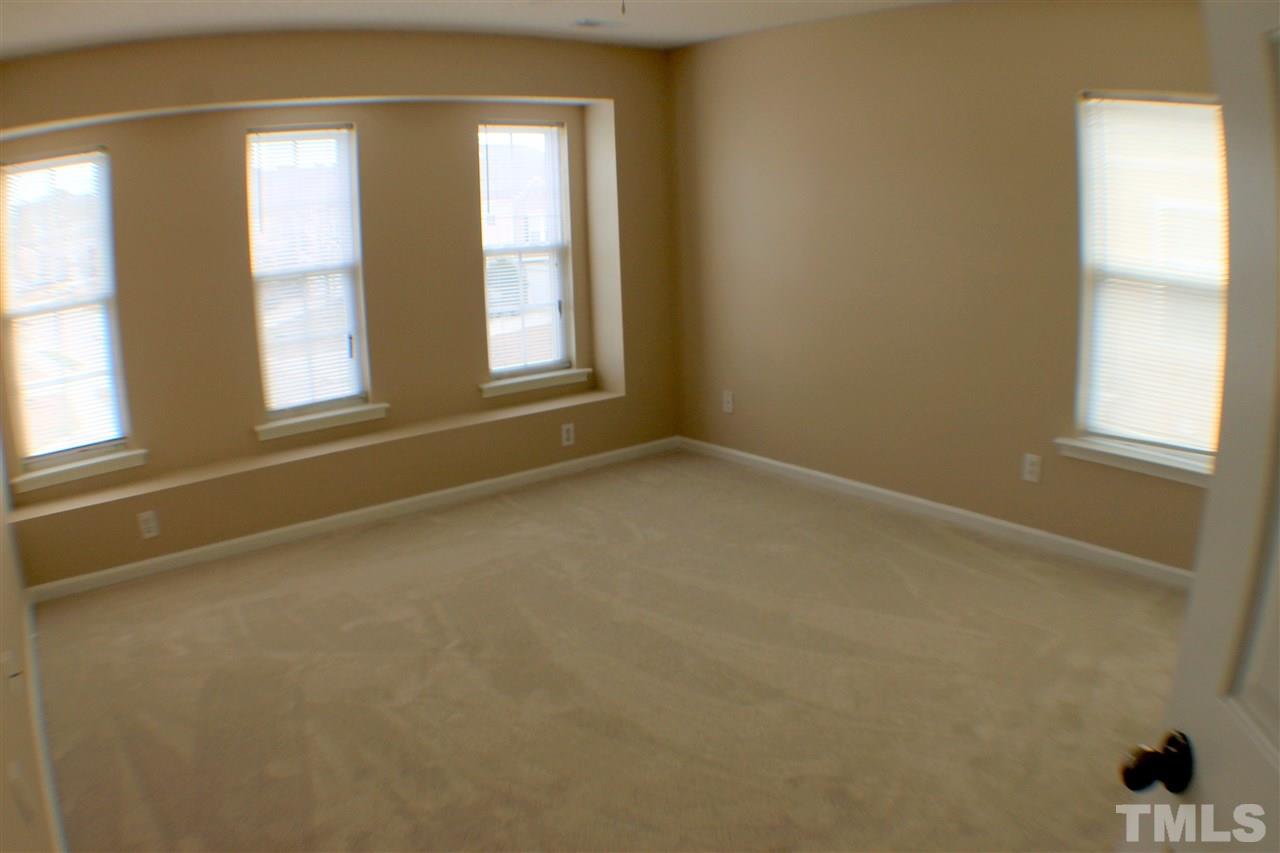 2856 Roundleaf Court Raleigh, NC 27604 - Photo 23 of 24 an empty room with windows