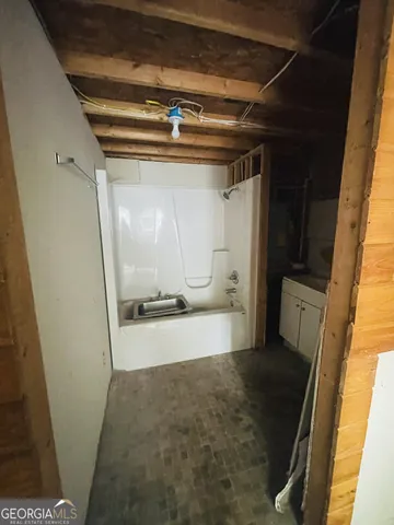 a view of a room with wooden walls