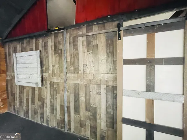 a bathroom with a shower and a window