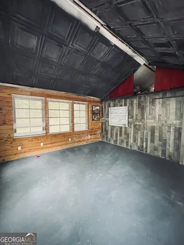 a view of a room with wooden walls