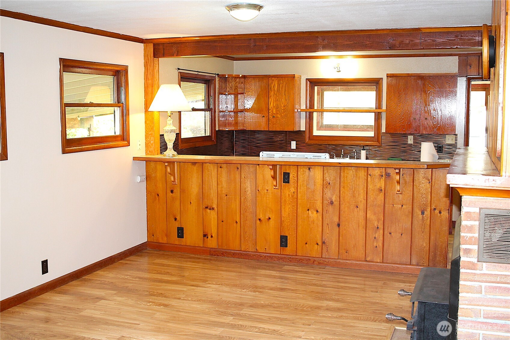 2621 Tokeland Road Tokeland, WA 98590 - Photo 11 of 38 a view of a kitchen with wooden floor and a large window