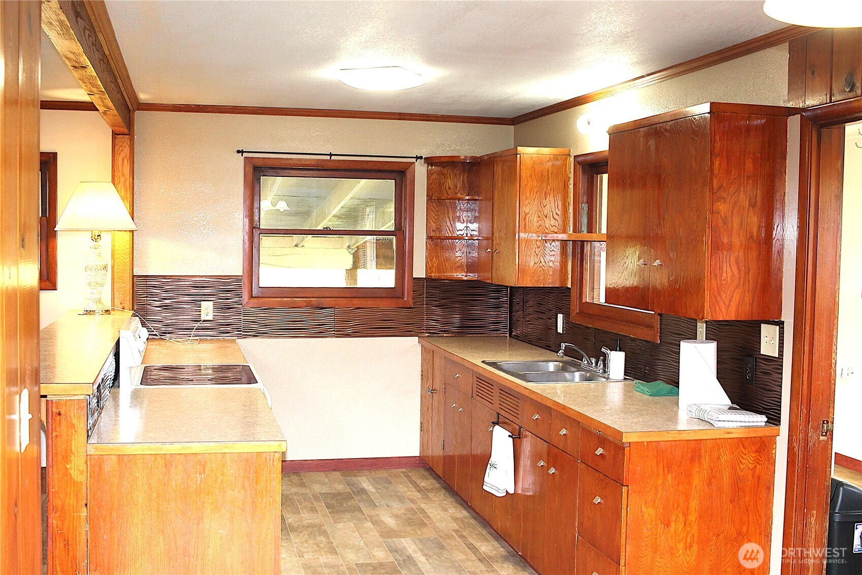 2621 Tokeland Road Tokeland, WA 98590 - Photo 14 of 38 a kitchen with a sink a counter top space and a window