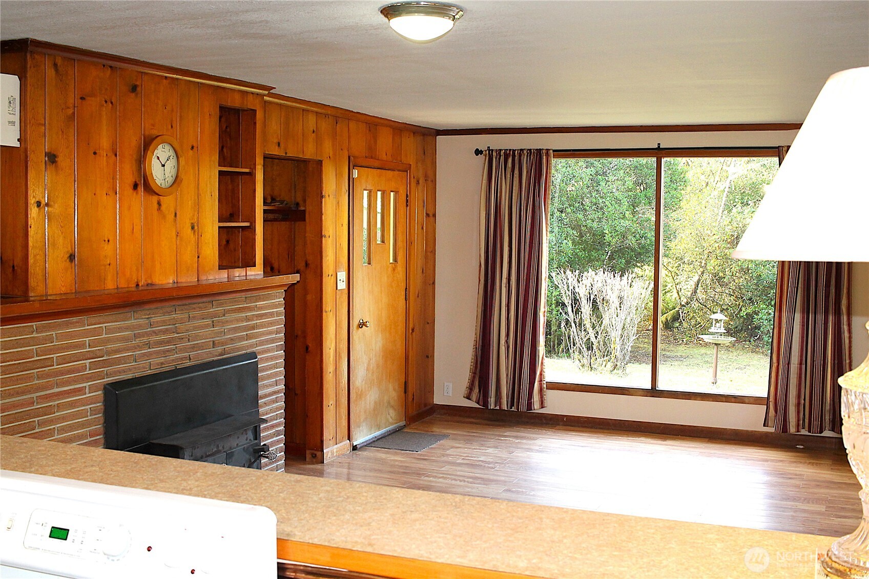 2621 Tokeland Road Tokeland, WA 98590 - Photo 7 of 38 a view of an empty room with a fireplace and a window