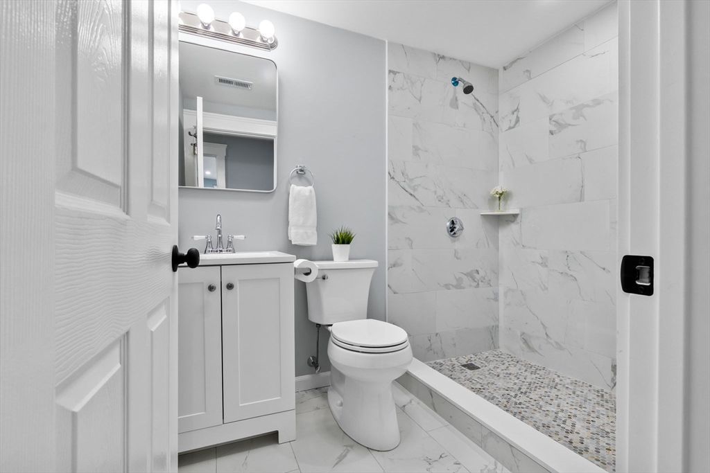 106 Hull Street Beverly, MA 01915 - Photo 18 of 34 a bathroom with a sink toilet and shower