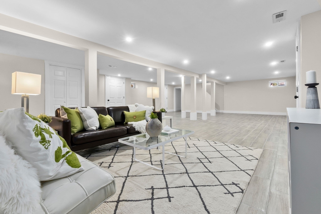 106 Hull Street Beverly, MA 01915 - Photo 21 of 34 a living room with furniture and a dining table with kitchen view