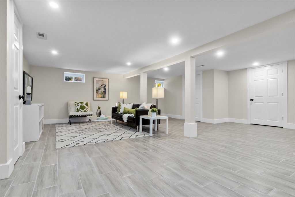 106 Hull Street Beverly, MA 01915 - Photo 24 of 34 a living room with furniture and a wooden floor